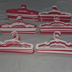 Set of Pink and White Plastic Hangers